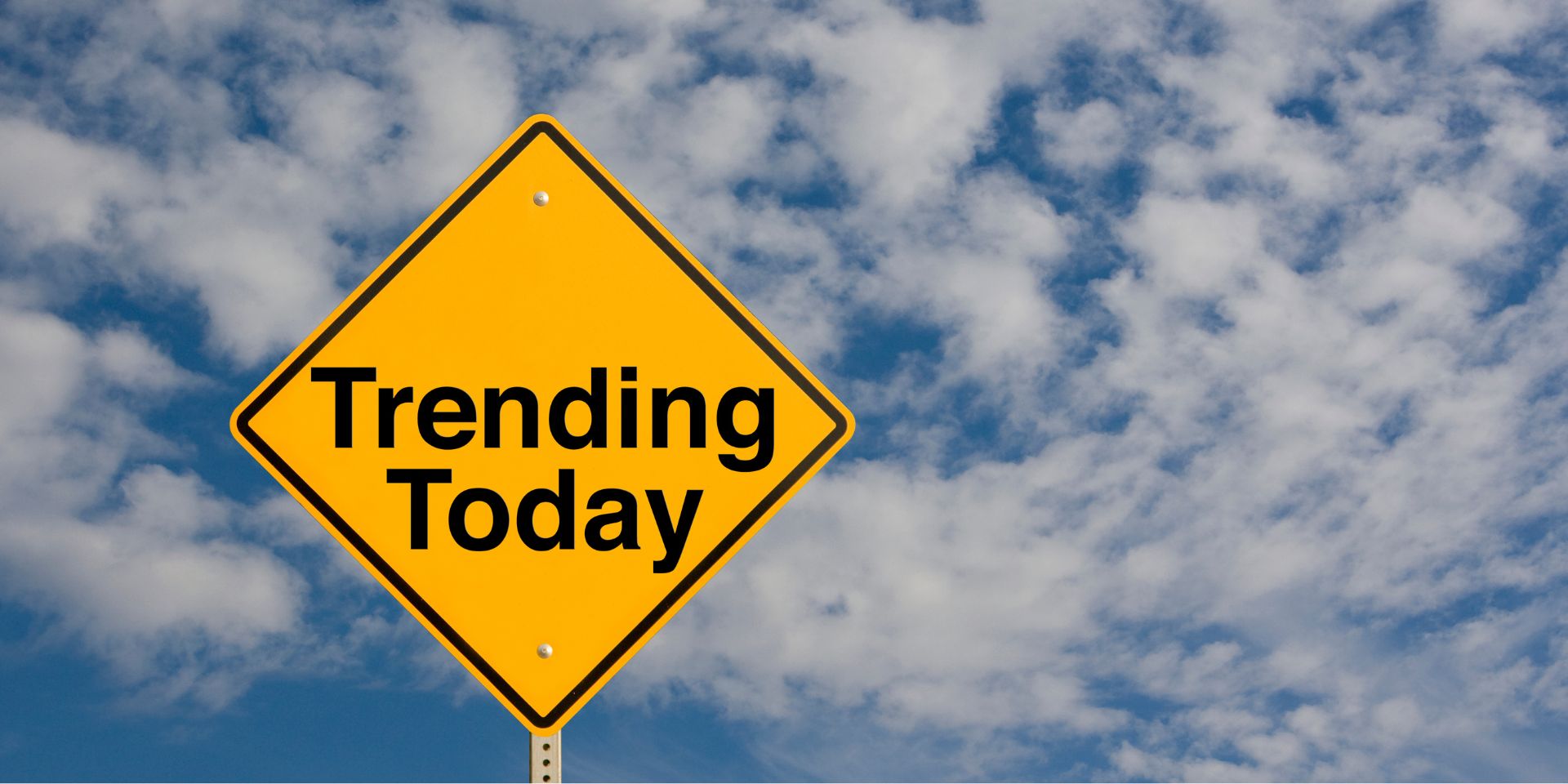 Orange diamond-shaped street sign with the words "trending today".