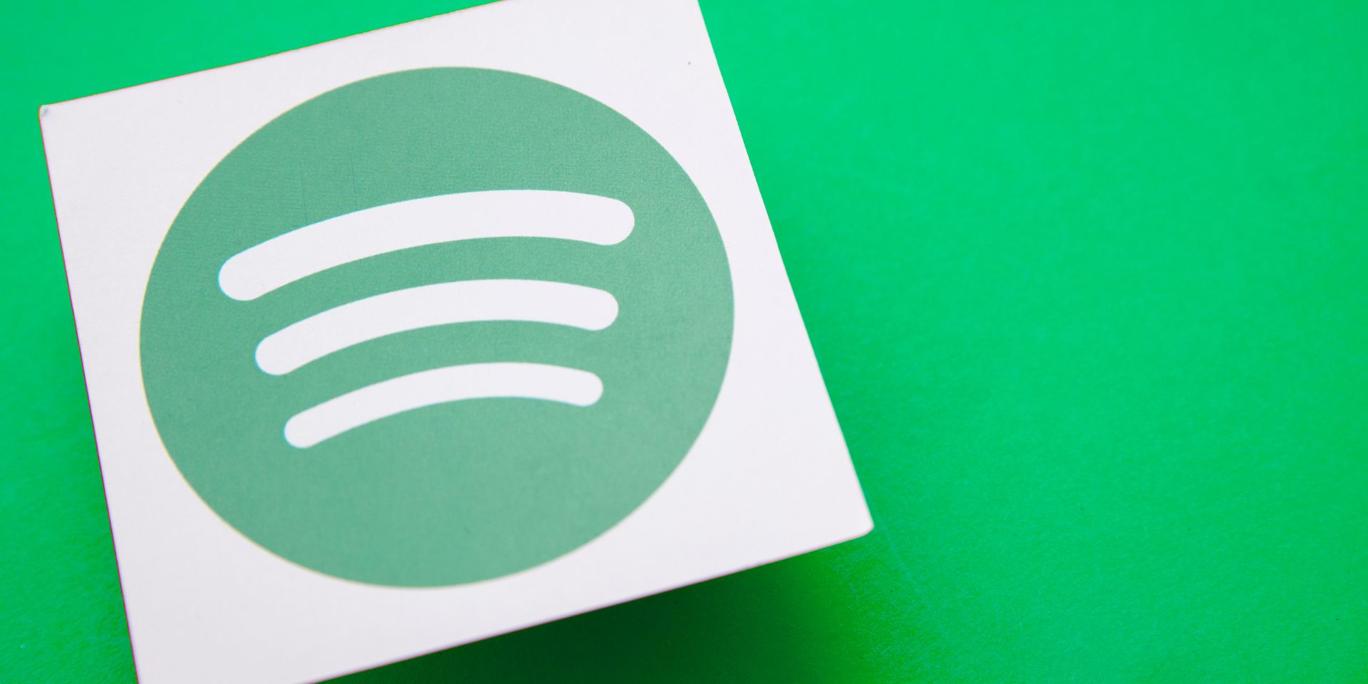 Spotify logo on a green backdrop.