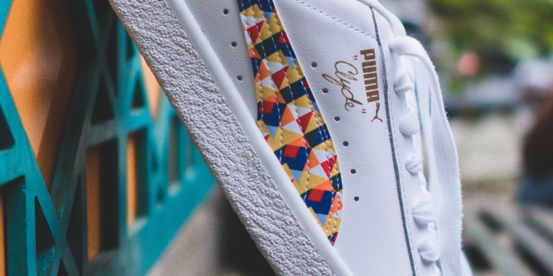 A pair of Puma trainers featuring multiple colours.