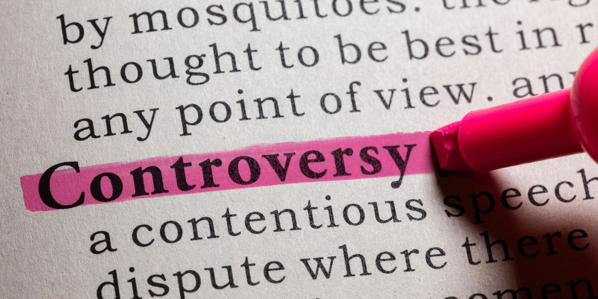 A dictionary page shows the word "Controversy" highlighted in pink.