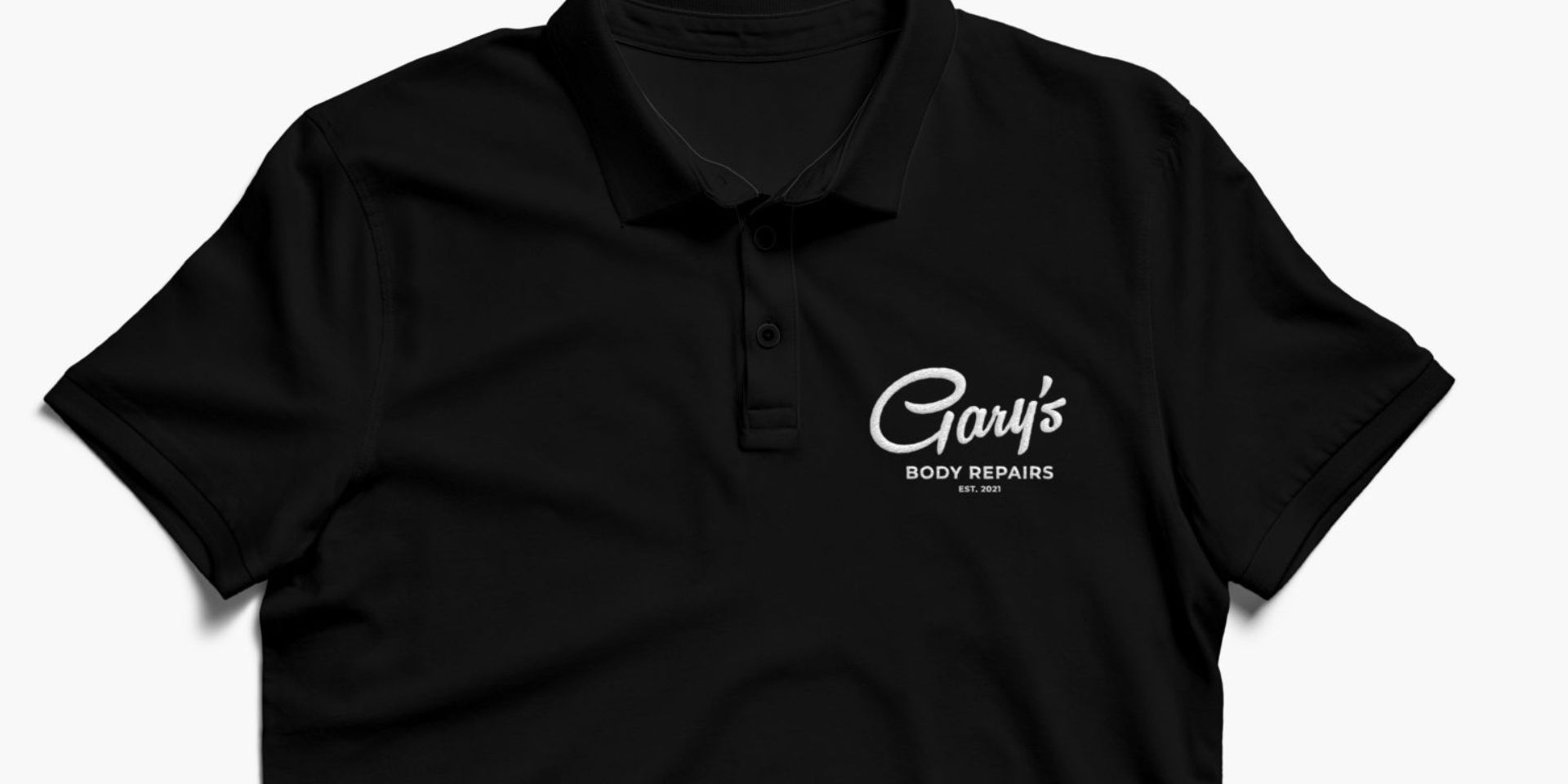 A black t-shirt shows the logo for Gary's Body Repairs (in white lettering).
