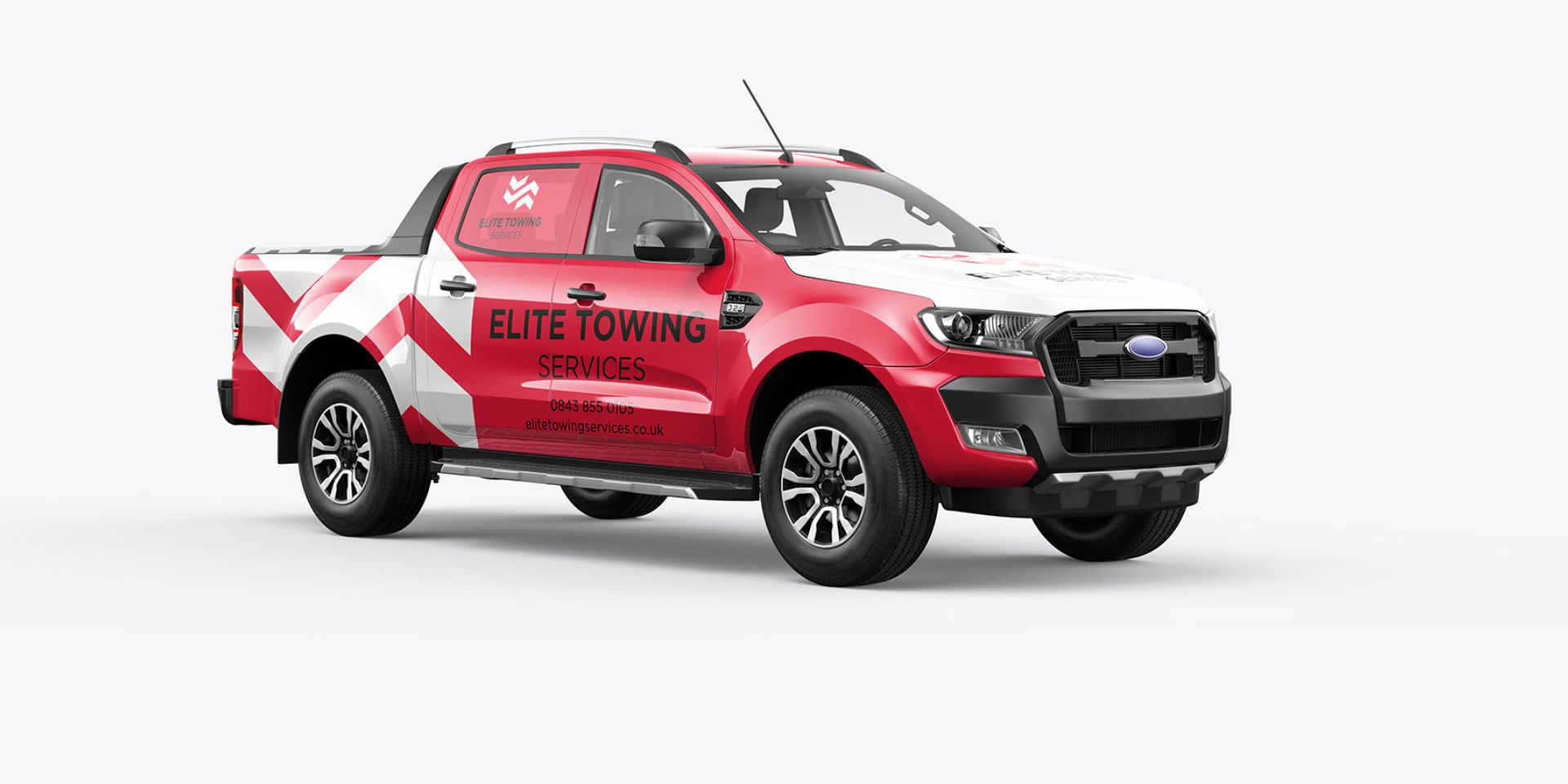 A red and white vehicle wrap is shown on a truck.