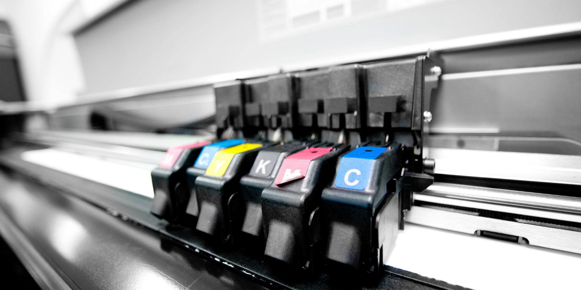 An image of the different printer inks within an industrial printer.